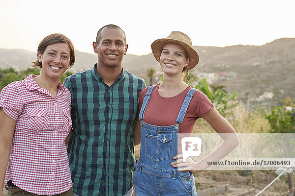 Group picture of three happy farmers