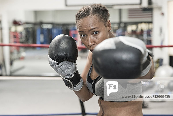 Black woman posing in boxing ring