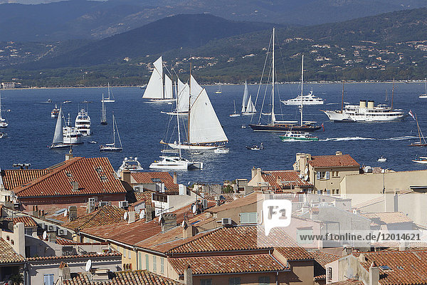 France  Var department  a large view on the old roofs of the city of Saint-Tropez with in background yachting boats