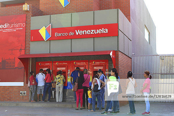 Venezuela. Money problems.people waiting at bank. Banco de Venezuela