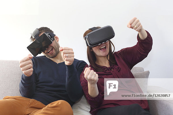 Young couple at home using virtual mask
