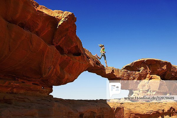Trailrunning at Rock Arch  Al Borg Alsagheer  Wadi Rum  Jordan  Asia