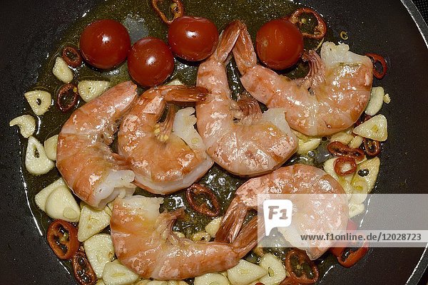 King prawns with garlic  chili and tomatoes in a pan  Tenerife  Canary Islands  Spain  Europe