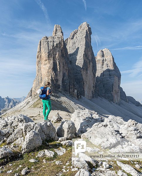 Hiker at the saddle of the Paternsattel  North faces of the Three Peaks  Sesto Dolomites  South Tyrol  Trentino-South Tyrol  Alto-Adige  Italy  Europe