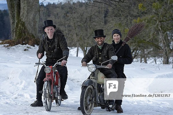 Chimney sweepers in winter on old mopeds  Upper Bavaria  Bavaria  Germany  Europe