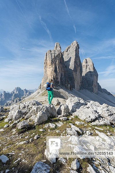 Hiker at the saddle of the Paternsattel  North faces of the Three Peaks  Sesto Dolomites  South Tyrol  Trentino-South Tyrol  Alto-Adige  Italy  Europe
