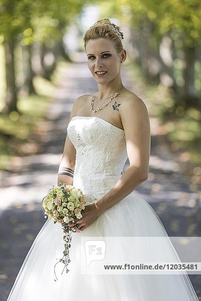 Young blonde woman in a white wedding dress  Switzerland  Europe