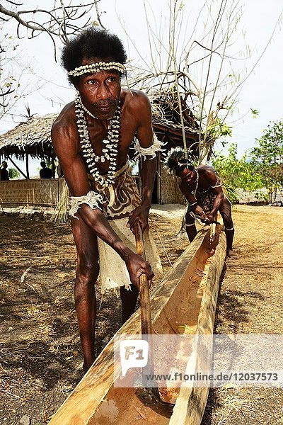 Korafe men  edit tree out for embarkation  boat building  Yavi Village  Tufi  Papua New Guinea  Oceania