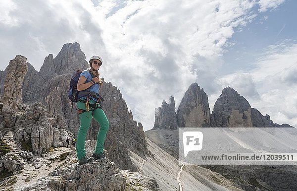 Hiker on the via ferrata to Patternkofel  Northern walls of the Three Peaks  Sesto Dolomites  South Tyrol  Trentino-South Tyrol  Alto-Adige  Italy  Europe