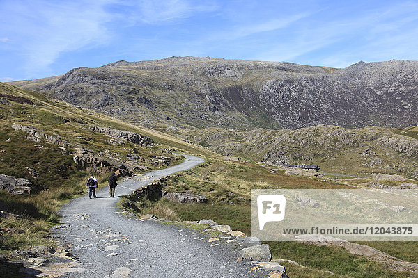 Hikers  Miners Track  one of the paths to summit of Mount Snowdon  Snowdonia National Park  North Wales  Wales  United Kingdom  Europe