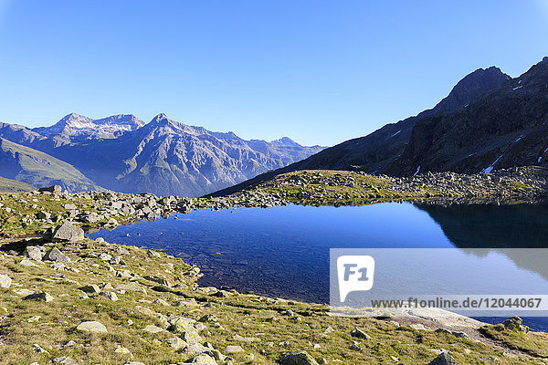 Lake Bergsee at sunrise Chiavenna Valley Spluga Valley Spluga Pass province of Sondrio Valtellina Lombardy Italy Europe