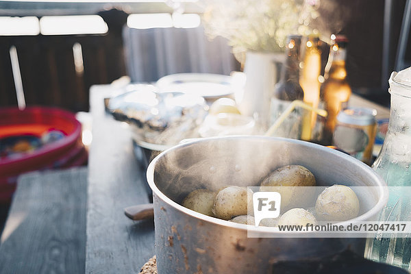 Close-up of food in container on wooden table at holiday villa