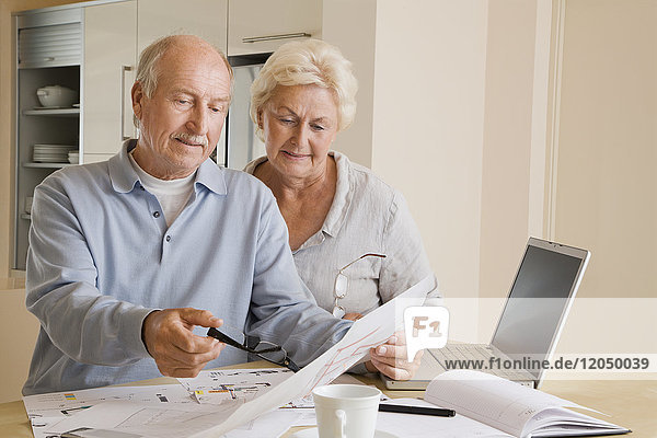 Couple Looking at Floor Plans