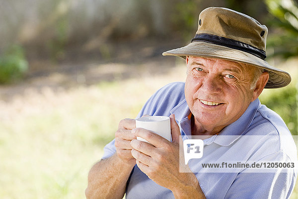 Portrait of Man Outdoors  Drinking Coffee