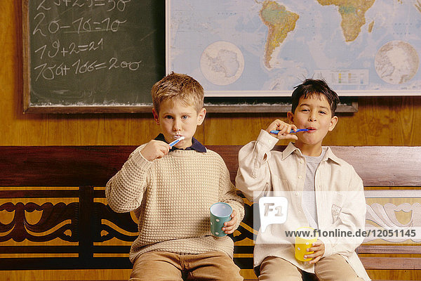 Children Brushing Teeth in Classroom