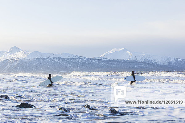 Surfers Entering Kachemak Bay Along Homer Spit  Southcentral Alaska  USA