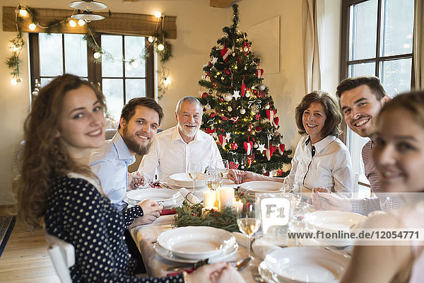 Happy family at Christmas dinner table