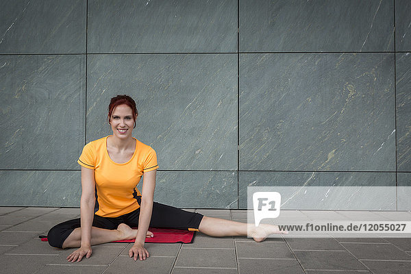 Young athlete stretching outdoors