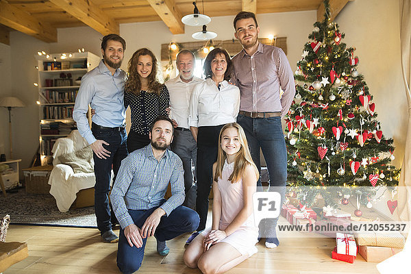 Portrait of family at Christmas tree