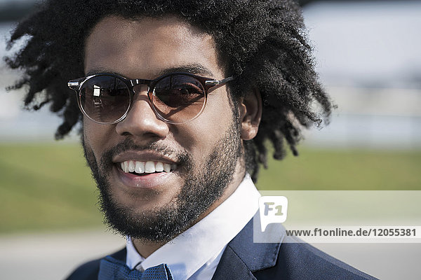Portrait of smiling young man with sunglasses