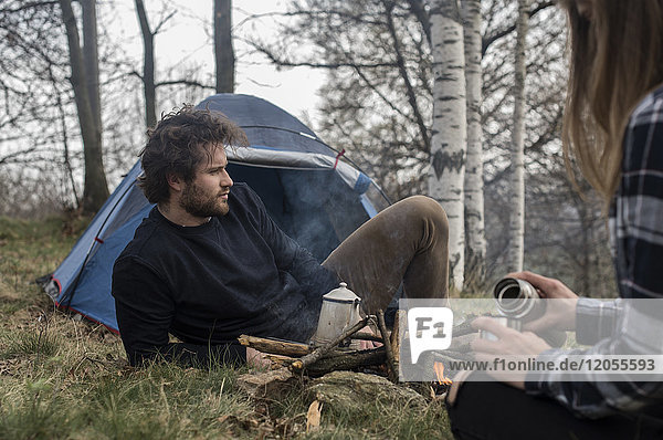 Couple camping in forest