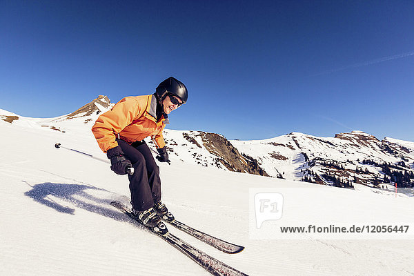 Austria  Damuels  woman skiing in winter landscape
