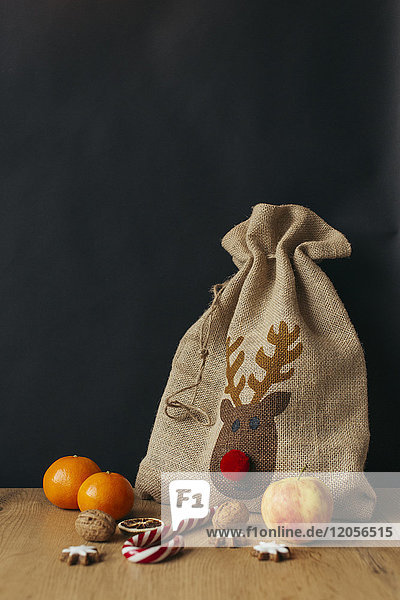Gunny bag  fruits  candy cane  walnuts and cinnamon stars