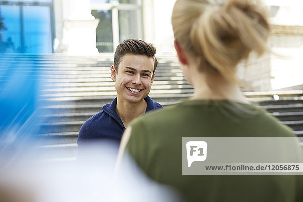 Portrait of happy young man face to face to his girlfriend