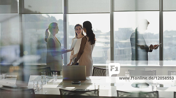 Businesswomen talking in conference room meeting