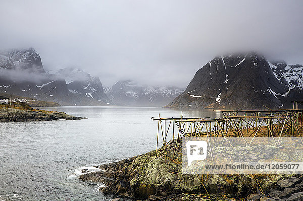Foggy  cold rugged mountains and river  Hamnoya  Lofoten  Norway
