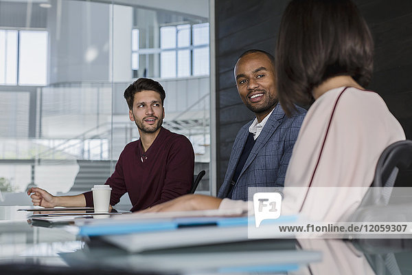 Smiling business people talking  planning in conference room meeting