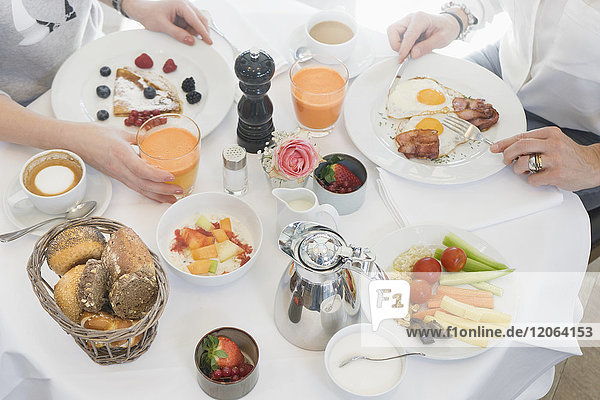 Women having breakfast on table