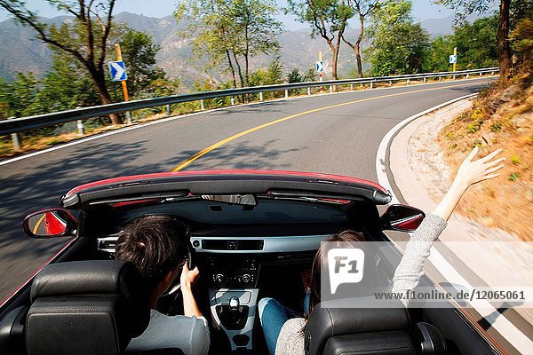 Young men and women driving out to travel