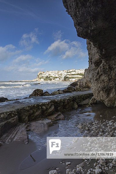 View of Peschici village from the cave Gargano National Park Foggia district Apulia Italy.