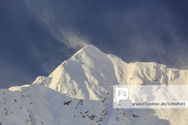 Wind on the snowy peak of Monte Rosetta Gerola Valley Sondrio province Valtellina Lombardy Italy.