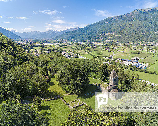 Panoramic of medieval Abbey of San Pietro in Vallate from drone  Piagno  Sondrio province  Lower Valtellina  Lombardy  Italy  Europe