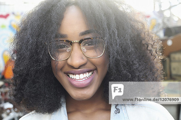 Close up of smiling mixed race woman wearing eyeglasses