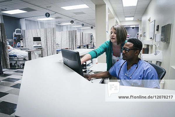 Doctor and nurse using computer