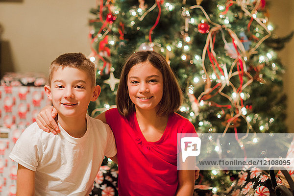 Portrait of brother and sister at Christmas
