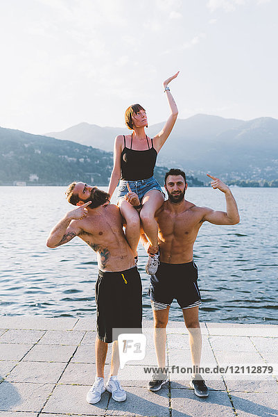 Portrait of three young hipsters posing at lake Como  Como  Lombardy  Italy