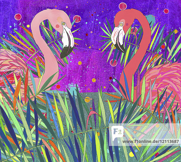Zwei Flamingos schauen sich in bunten Blättern an
