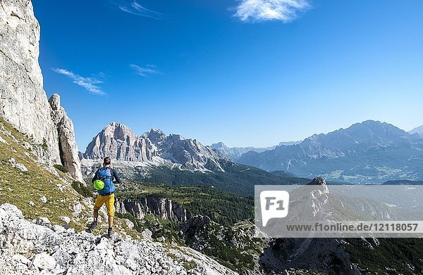Hiker on footpath to the Nuvolau  view of the mountain range Tofane  Dolomites  South Tyrol  Trentino-Alto Adige  Italy  Europe