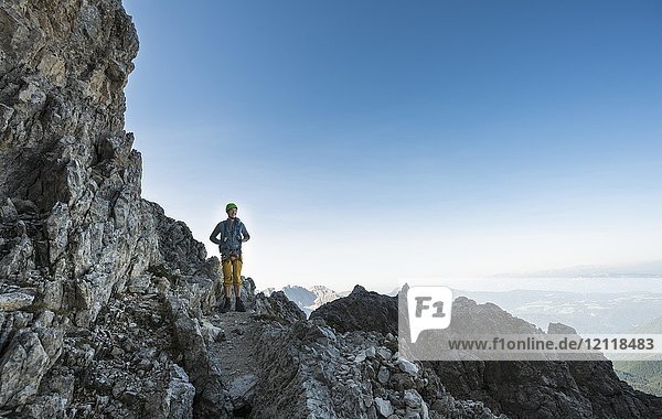 Hiker on the Santner via ferrata  Rosengarten Group  Dolomites  South Tyrol  Trentino-Alto Adige  Italy  Europe