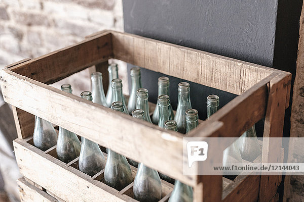 Empty bottles in a wooden crate
