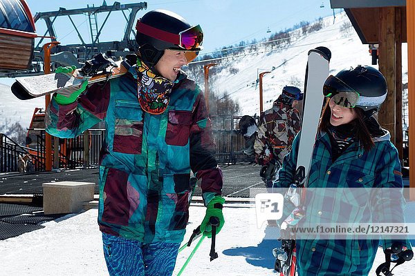 Young men and women outdoor skiing