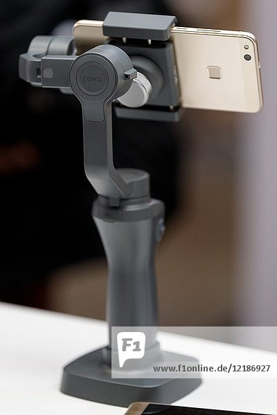 March 3, 2018, Yokohama, Japan - The new DJI OSMO MOBILE 2 on display at the CP+ Camera & Photo Imaging Show 2018 in Pacifico Yokohama. Japan's largest camera and photo imaging exhibition bring together 1, 123 exhibitor booths during the four-day trade show at the Pacifico Yokohama and OSANBASHI Hall. Organizers expect approximately 70, 000 visitors until March 4th.