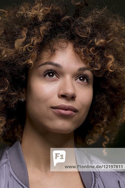 Portrait of woman with curly hair