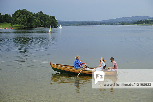 Germany  Bavaria  Murnau  family in rowing boat