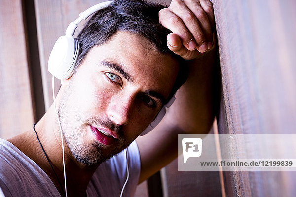Portrait of handsome young man wearing headphones