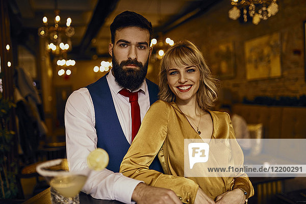 Portrait of elegant couple in a bar